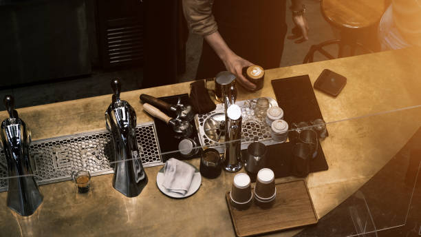 Coffee Shop Bar Counter Cafe Restaurant Relaxation, coffee extraction from professional coffee machine with bottomless filter.