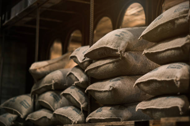 Stack hemp sacks of rice, Sacks of rice in the warehouse, containing rice placed profoundly stacked in a row to keep up.