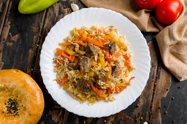 istock pilaf with beef on wooden table top view 1405841334