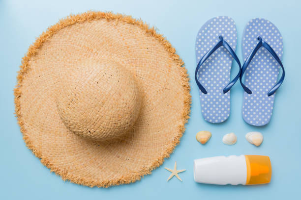 istock Summer vacation concept flat lay. straw hat beach accessories and towel top view. Space for text. travel concept 1405841814