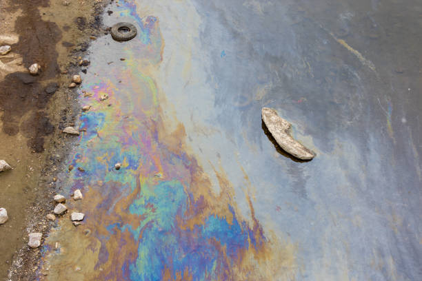 istock Debris and oil spill on water surface 1405841948