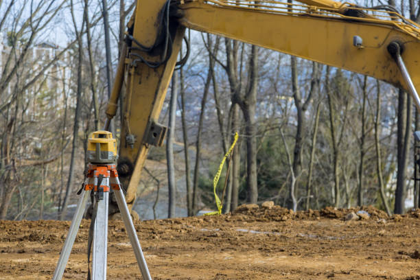 istock Construction measuring equipment like rotary laser levelers is used during road construction by the contractor 1405843751