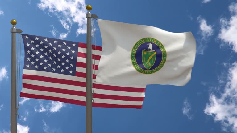 USA Flag with United States Department Of Energy Flag on a Pole