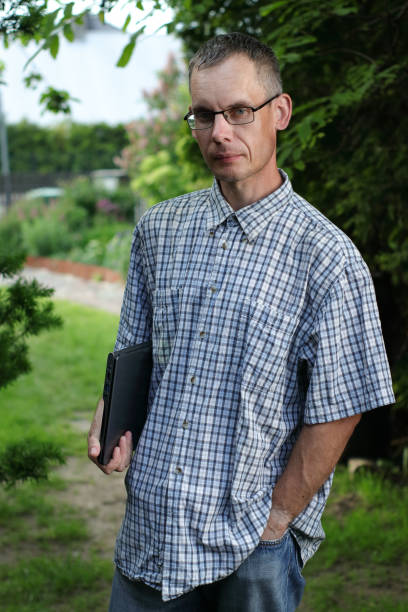 istock person holding a laptop 1405845189