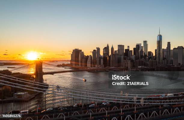 Manhattan And Brooklyn Bridges Against Golden Sunset Aerial Scenic Shot Of Group Of Modern Skyscrapers Manhattan New York City Usa Stock Photo - Download Image Now