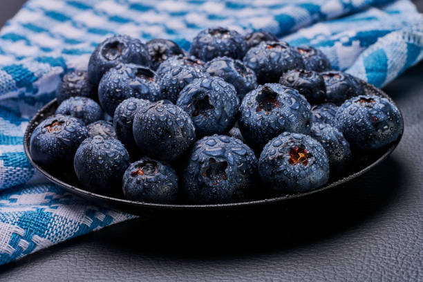 blueberries in black background stock photo