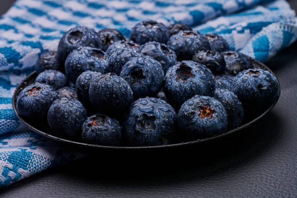 blueberries in black background stock photo
