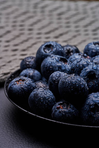 blueberries in black background stock photo