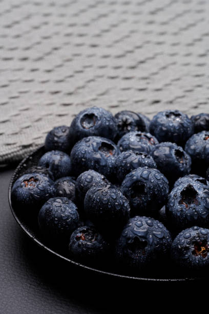 blueberries in black background stock photo