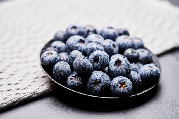 blueberries in black background stock photo