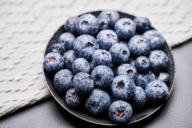 blueberries in black background stock photo