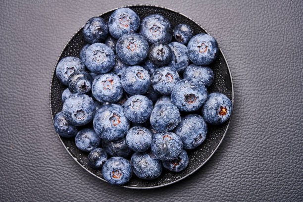 blueberries in black background stock photo