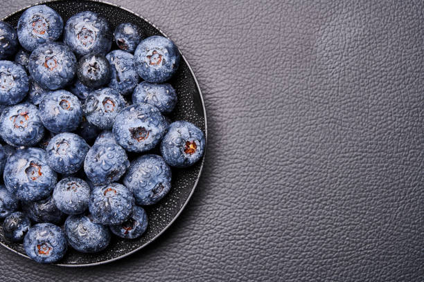 blueberries in black background stock photo