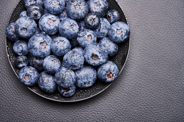 blueberries in black background stock photo