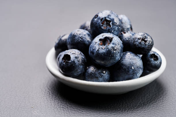 blueberries in black background stock photo