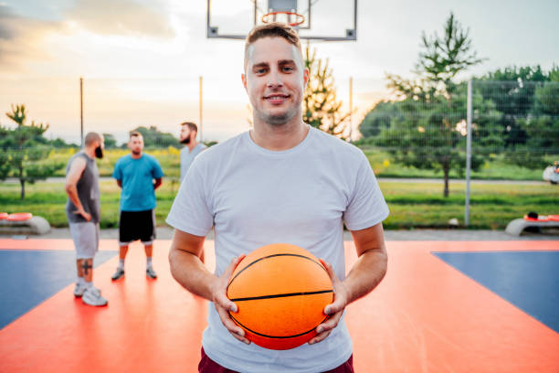 istock Man standing on basketball court 1405847847