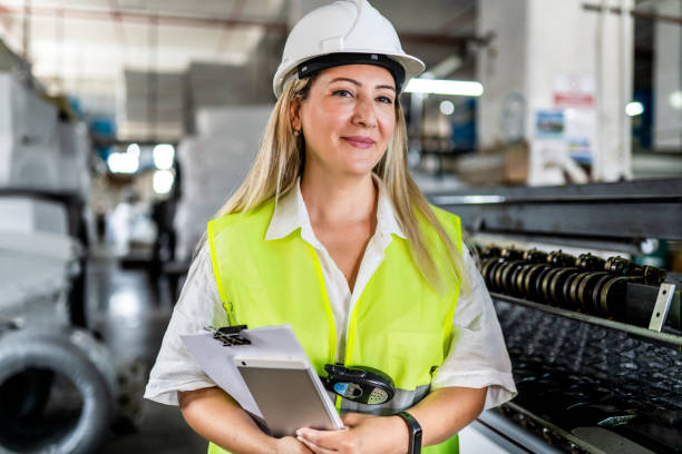 Portrait of female engineer working in factory stock photo