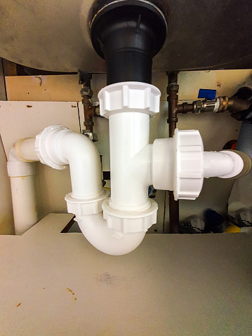 A PVC under sink pipe layout to take waste water from kitchen or bathroom to the waste water sewage system below.