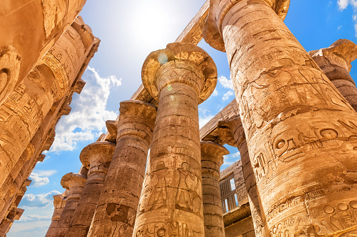 Great Hypostyle Hall, columns with ancient carvings, Karnak Temple, Luxor, Egypt.