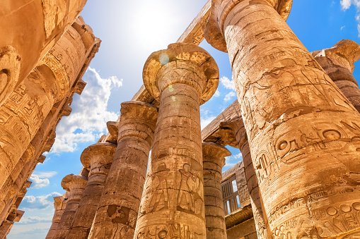 Abydos, Egypt - November 07, 2018 :  \nThe guardian of the temple captured as he contemplates the rays of light that enters the temples through the openings of the walls.