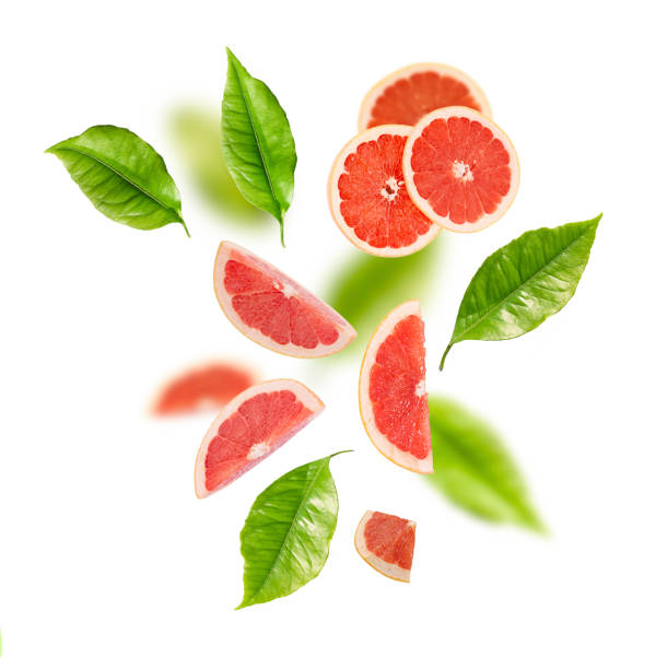 istock Composition of citrus grapefruit and green leaves on a white background. 1405856571