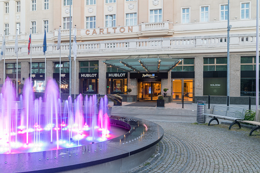 Bratislava, Slovakia - May 31, 2022: Entrance to Radisson Blu Carlton Hotel in the evening.