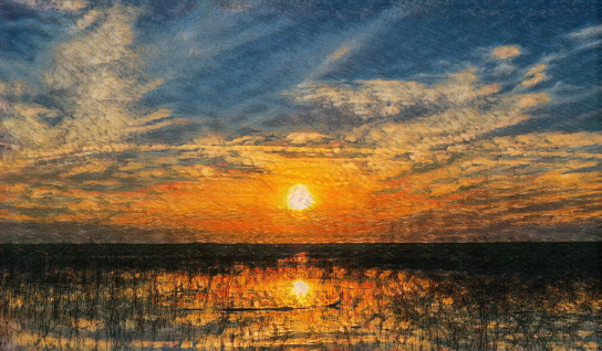 Sunset over lake Okeechobee in Florida; in bold colors.