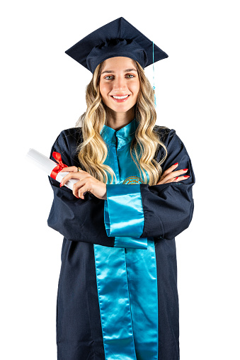 Graduation portrait of beautiful blonde woman with cap and gown isolated on white background