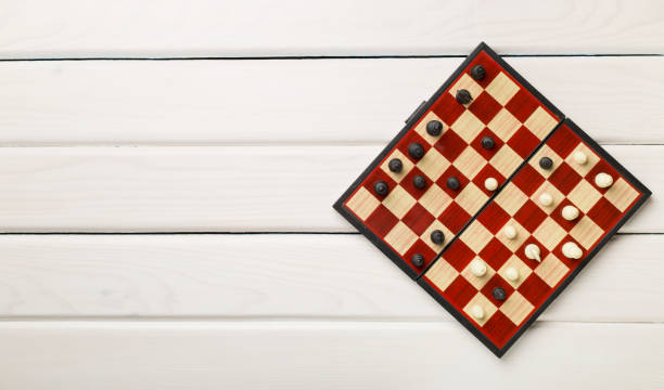 istock Chess on wooden background, top view 1405863816