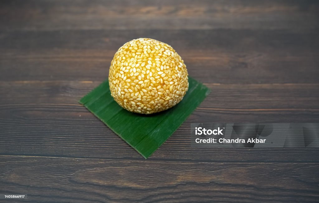 Indonesian Street Food a type of cake snack market famous in Indonesia. Onde-onde can be found in traditional markets or sold at street food vendors Color Image Stock Photo