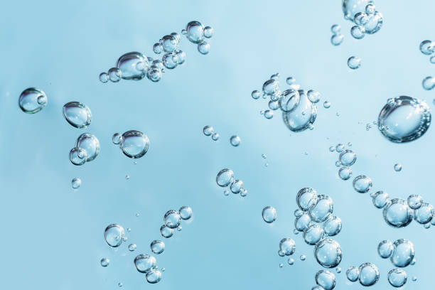 istock Close up macro Aloe vera gel cosmetic texture blue background with bubbles. 1405869022