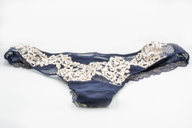 istock Blue lace panties closeup on white. 1405870937