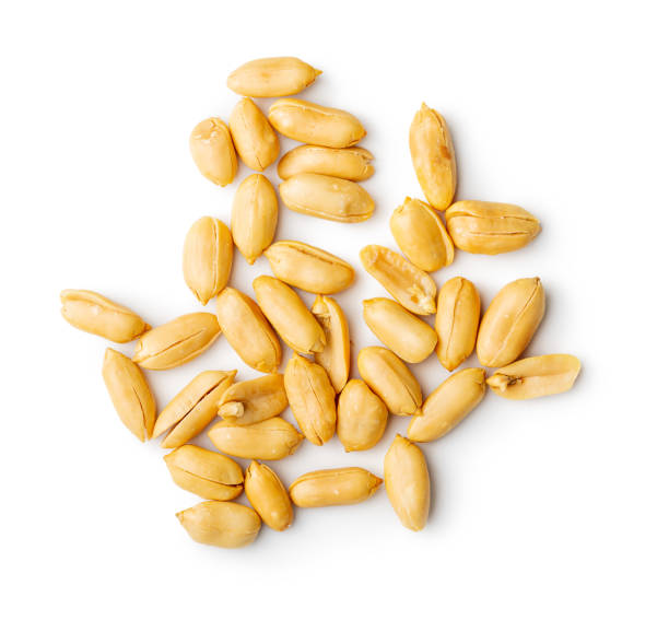 istock Roasted peeled peanuts isolated on white background. 1405873681