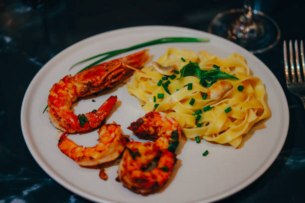 istock Pasta with shrimps and langustine. Seafood. Home cooking. 1405873805