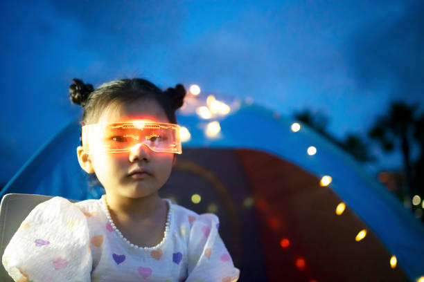 istock Little girl's virtual glasses game 1405873962