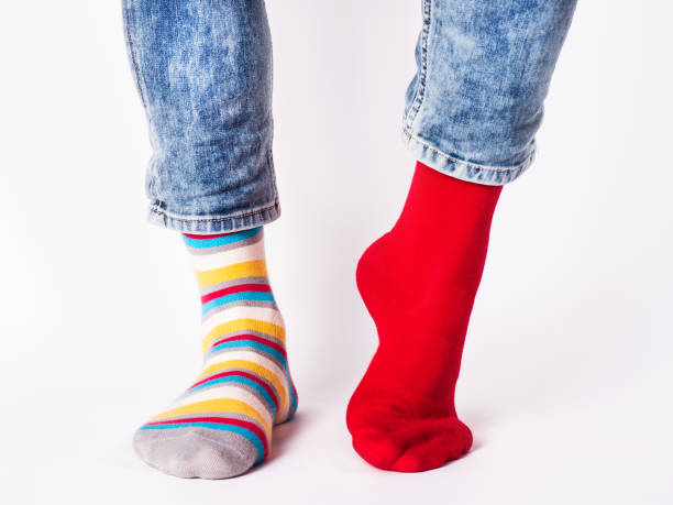 istock Men's legs and bright socks. Without shoes 1405874351