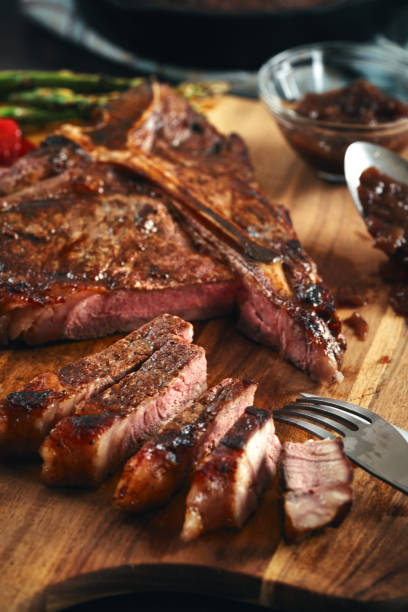 istock Grilled T-Bone Steak with Asparagus, Tomatoes and Mushrooms 1405876753