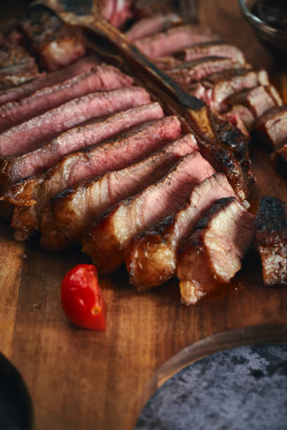 istock Grilled T-Bone Steak with Asparagus, Tomatoes and Mushrooms 1405876780
