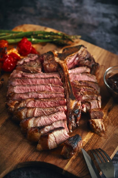 istock Grilled T-Bone Steak with Asparagus, Tomatoes and Mushrooms 1405876782