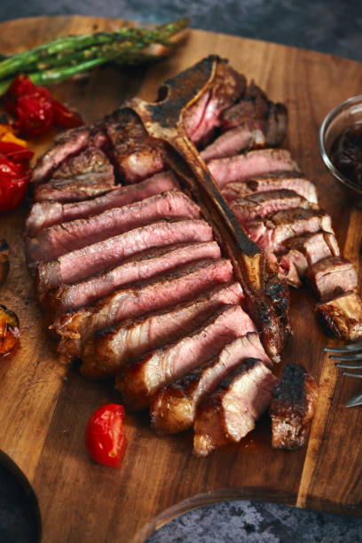 istock Grilled T-Bone Steak with Asparagus, Tomatoes and Mushrooms 1405876791