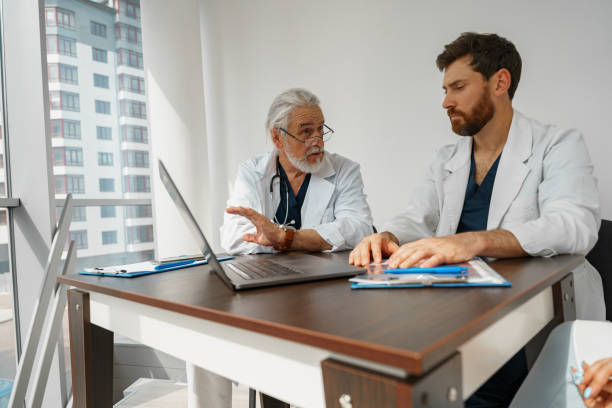 istock Successful medical doctors are discussing diagnosis during the conference 1405876882