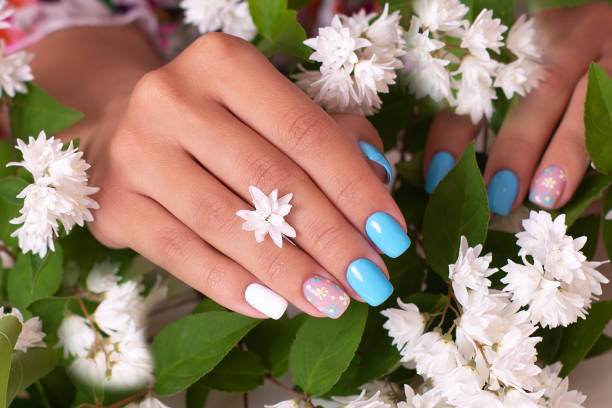 istock Female hands with summer manicure nails 1405881959