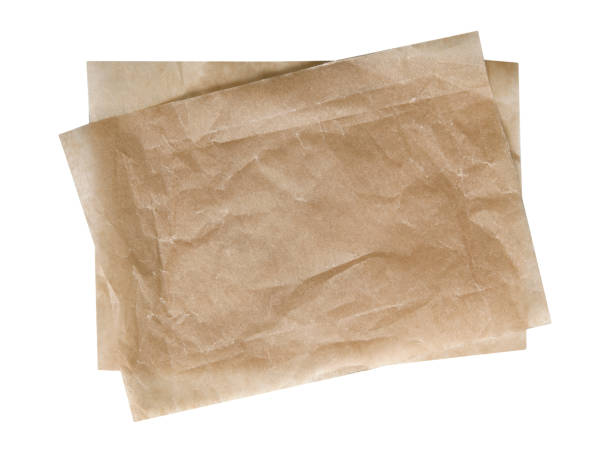 istock Brown kitchen bakery paper pieces top view isolated on white. 1405884096