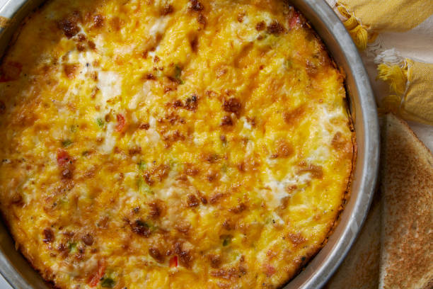 Crustless Sausage and Peppers Quiche Individual Low Carb Crustless Sausage and Peppers Quiche with Toast frittata stock pictures, royalty-free photos & images