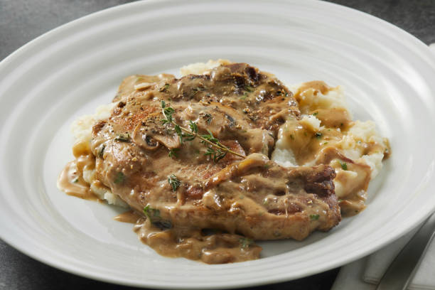 istock Braised Pork Chops in Creamy Mushroom Sauce 1405888619