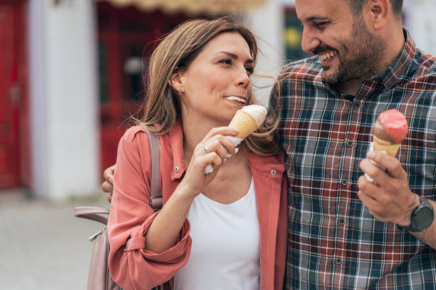 istock Happy couple eating ice cream 1405888695