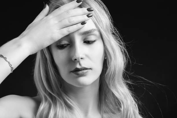 istock woman with headache 1405889501