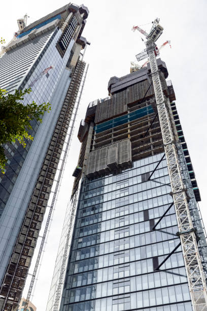 istock Construction of skyscrapers, white background with copy space 1405891516