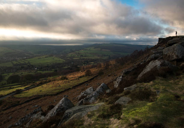 Cloudy sky and hillside stock photo