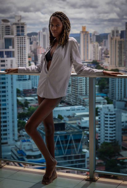 istock Beautiful black girl standing on terrace 1405901103